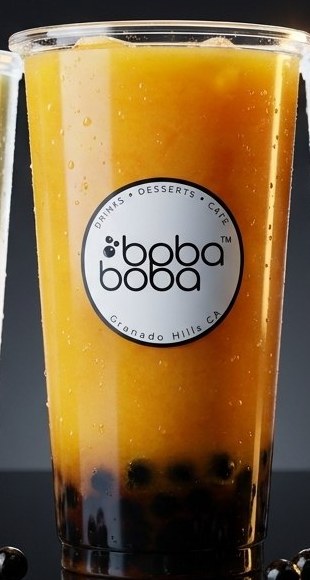 Bright mango slush over a dark chamoy base