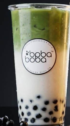 Layered iced matcha latte with tapioca pearls