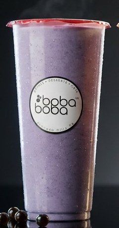 Lavender taro milk tea in a sealed Boba Boba cup